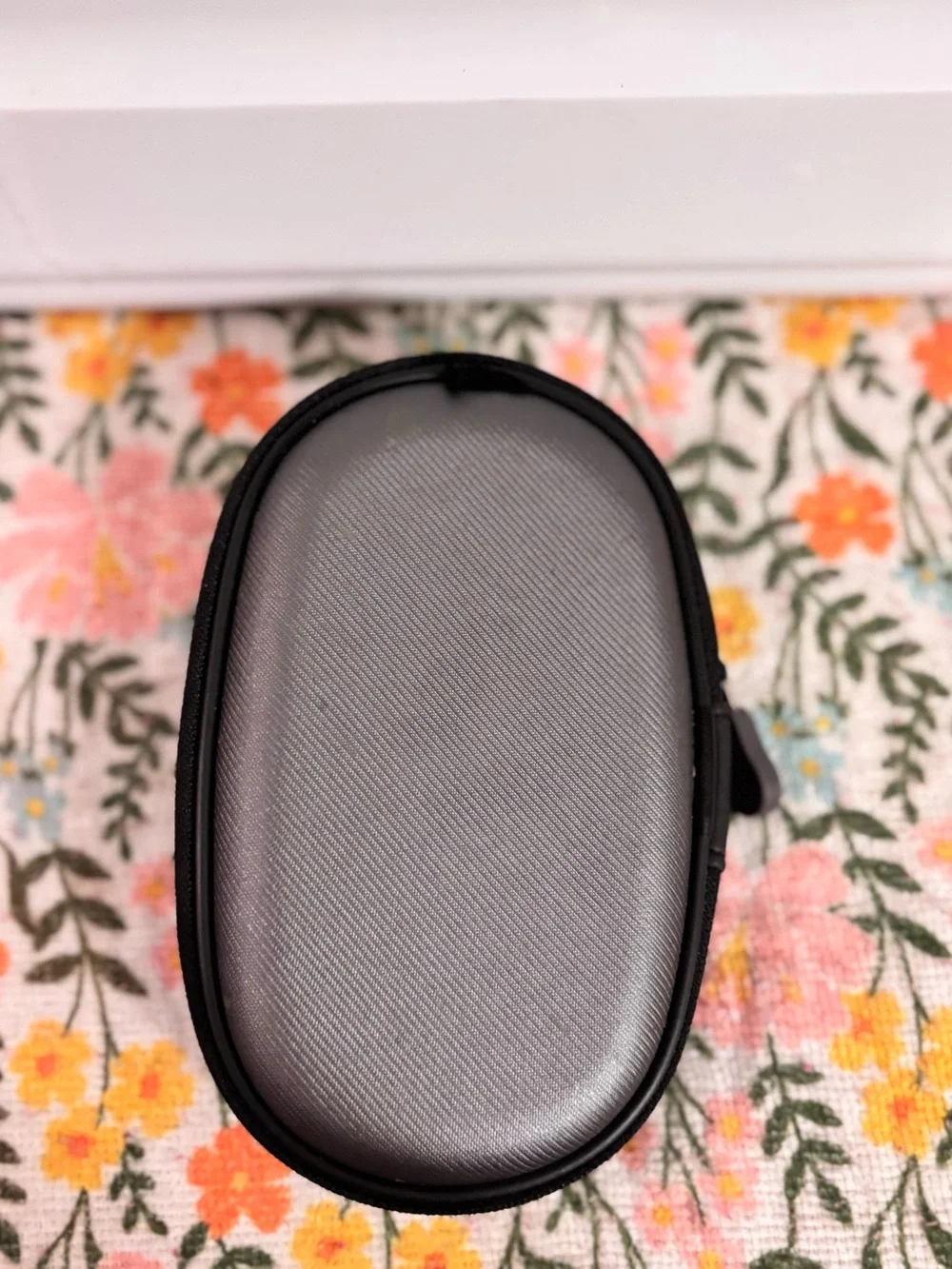 HMDX HX-G03 portable speaker featuring a black fabric grill and silver accents
